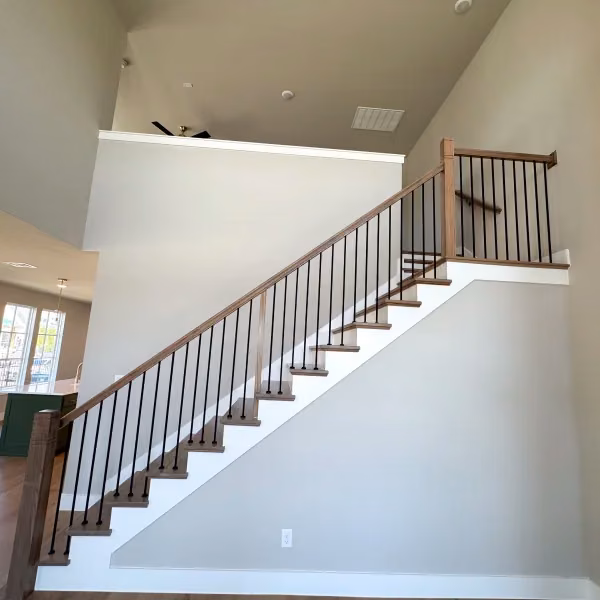 Custom staircase & railing by FJR Stair & Door in a DFW home