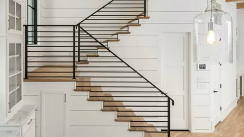 Modern open staircase with iron balusters in an Arlington, TX home